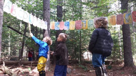 Learning the alphabet in an outdoor classroom